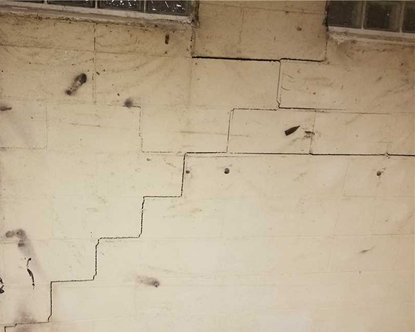Stair step cracks on wall